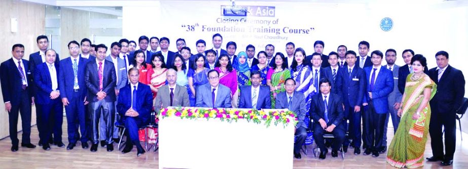 A. Rouf Chowdhury, Chairman of Bank Asia, poses with the participants of 38th Foundation Training Course for the bank's officers in the city recently. Md. Arfan Ali, President & Managing Director of the Bank, Mian Quamrul Hasan Chowdhury, Deputy Managing
