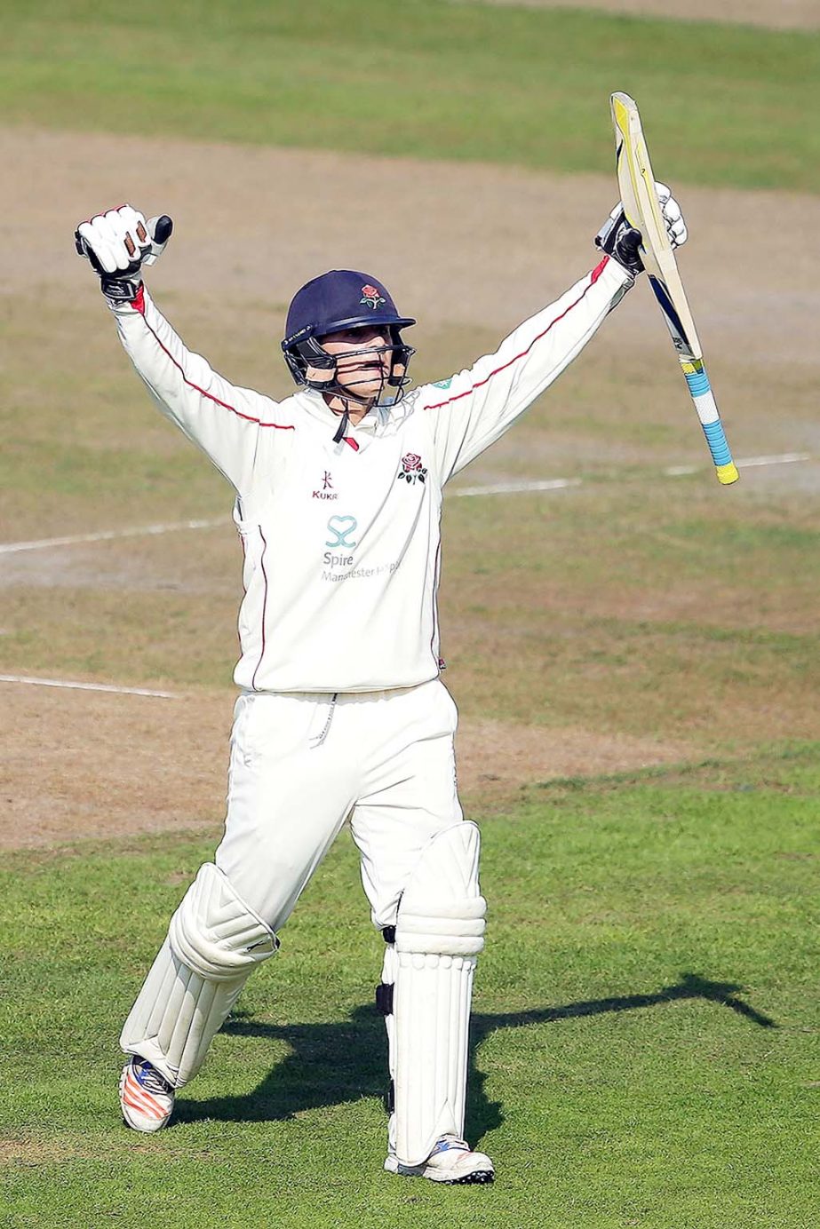 Rob Jones celebrates his maiden first-class hundred on the 3rd day of Division One in County Championship between Lancashire and Middlesex at Old Trafford on Wednesday.