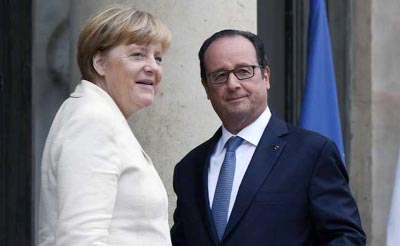 French President Francois Hollande welcomes German Chancellor Angela Merkel for a working meeting.