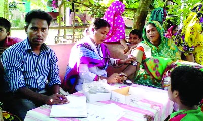 BARISAL: Doctor is checking a patient at a medical camp at Gouranadi Upazila recently.