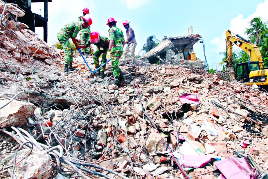 Members of Armed Forces and Fire Fighting units still continuing rescue operation at the debris since the boiler explosion of the plastic packaging factory of Tampaco Foils Limited in Tongi on September 10. This photo was taken on Friday.