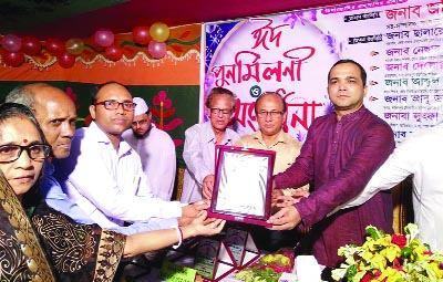 FENI: Jahir Uddin Mahmud Lipton, Assistant Secretary, Sub- Committee, Bangladesh Awami League giving a crest to Bijoy Kumar Das for being appointed in 34th BCS (Education) at a reception and Eid re-union programme accorded to meritorious students o