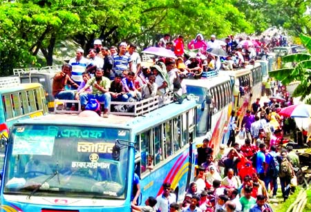 Thousands of people were seen desperate to return to the capital but they remained stranded at Mawa Ghat in Munshiganj as the Mawa-Kawrakandi ferry route facing a huge pressure of vehicles following the disruption of ferry service. This photo was taken fr