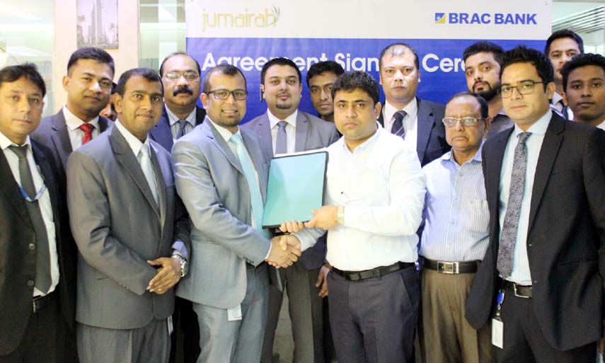 Kyser Hamid, Head of Retail Sales, BRAC Bank, Md. Shahjahan, Managing Director, Jumairah Holdings Ltd signing a Retail Banking Service Agreement with BRAC Bank Limited and Jumairah Holdings Ltd on behalf of their respective organisations. S. M. Moinul H