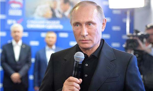 Russian President Vladimir Putin speaks during his visit to the United Russia political party's election campaitn headquarters during parliamentary elections in Moscow on Sunday.