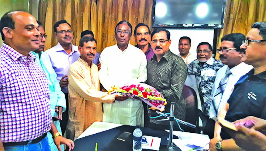 Ataur Rahman Prodhan, Managing Director of Rupali Bank Limited, receiving a flower bouquet from the local businesses at the Hotel North View in Rangpur city recently.