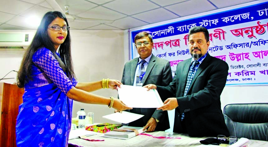 Md. Obayed Ullah Al Masud, Managing Director of Sonali Bank Limited, handing over certificates among the newly appointed officers at the banks staff college on Monday. Principal of the college Md Rezaul Karim Khan and faculty members, among others, were a