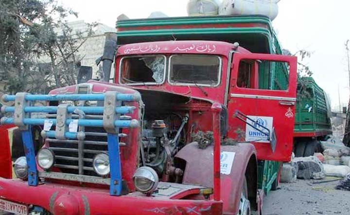 A damaged truck is pictured after an airstrike on the rebel held Urm al-Kubra town.