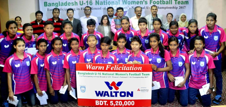 Members of Bangladesh National Women's Under-16 Football team, the officials of Walton Group, the officials of Bangladesh Football Federation (BFF) pose for a photo session at the conference room of BFF House on Tuesday.