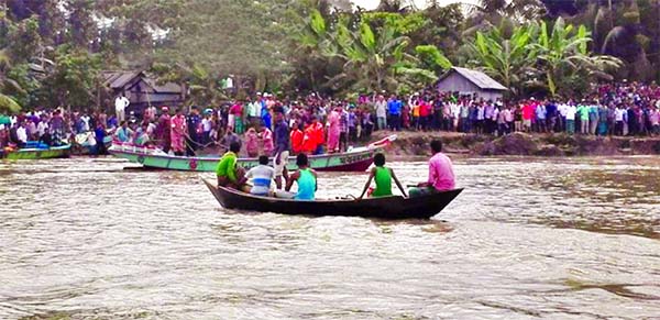 A launch with 80 passengers sank in Barisalâ€™s Sandhya River on Wednesday. Divers recovered about 14 bodies. This photo was taken from Banaripara area.