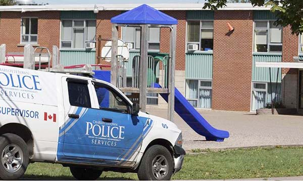 A Charlottetown police vehicle drives into Sherwood Elementary School in Charlottetown, Prince Edward Inland on Wednesday.