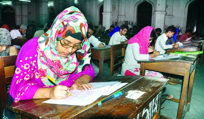 Dhaka University (DU) honours admission seekers engrossed in answering the questions in Kha-unit admission test. The snap was taken from the Curzon Hall of the university on Friday.