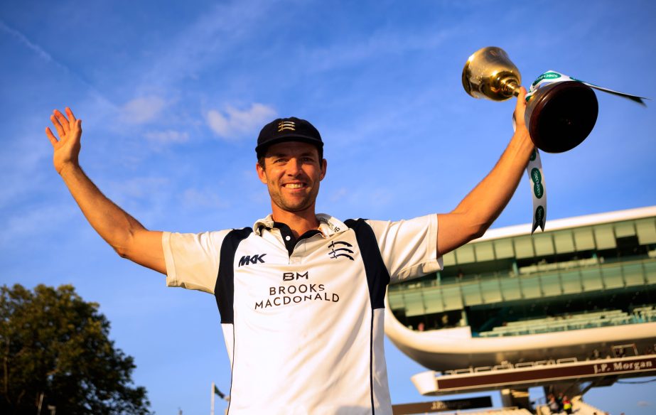 Middlesex captain James Franklin poses with the County Championship trophy after their English County Championship cricket match against Yorkshire at Lord's in London on Friday. One of the most thrilling climaxes to an English County Championship saw Mid