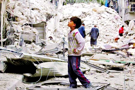 A boy inspects a damaged site after airstrikes on the rebel held Tariq al-Bab neighborhood of Aleppo, Syria. (Inset) effected people inspecting their destroyed houses on Saturday. Ruters photo