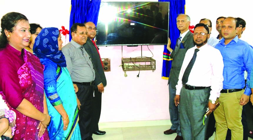 Syed Abu Asad, Deputy Managing Director of Sonali Bank Ltd, handing over a television set to Dhaka University VC Dr AAMS Arefin Siddiqui for Nawab Faizunnesa Chowdhurani Mohila Hostel at the hostel recently. Mofazzol Hossain, General Manager and Nurul Haq