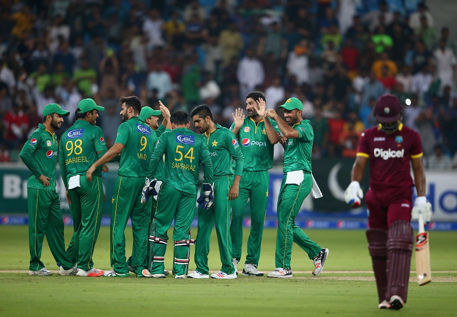 Sohail Tanvir of Pakistan celebrates wirh teammates after dismissing Evin Lewis of West Indies during the second T20 International match between Pakistan and West Indies at Dubai International Cricket Stadium in Dubai, United Arab Emirates on Saturday.