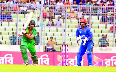 Tamim Iqbal hits a shot against Afghanistan during their first One-Day International cricket match at Sher-e-Bangla National Cricket Stadium in Mirpur on Sunday.