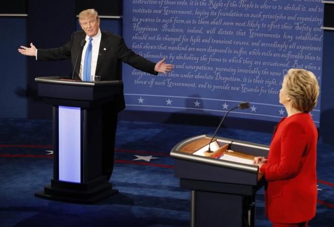 Republican U.S. presidential nominee Donald Trump speaks as Democratic U.S. presidential nominee Hillary Clinton listens during their first presidential debate at Hofstra University in Hempstead, New York, U.S., September 26, 2016. REUTERSRick Wilking