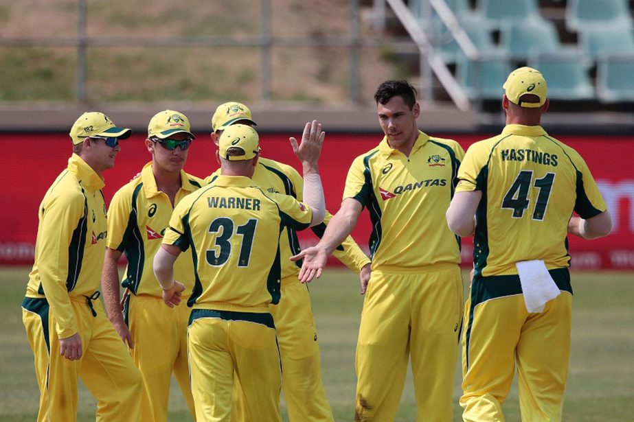 Australia's bowler Scott Boland (2nd from R) celebrates the dismissal of Ireland batsman Paul Stirling (not in picture) during Australia against Ireland ODI cricket match at Willowmoore cricket ground in Benoni, South Africa on Tuesday. Australia won the