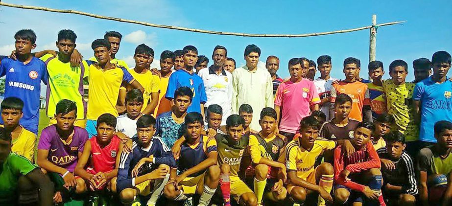 The participants of the grass-root level under-15 talent hunt programme and the instructor Jahan-e-Alam Noori pose for a photo session at Sadar Upazila of Sunamganj District on Tuesday. Development Committee of Bangladesh Football Federation has arranged