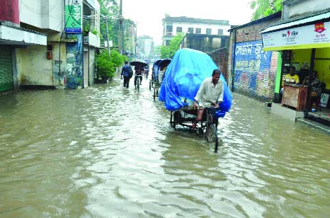 BOGRA: Different areas in Bogra city are inundated due to heavy rainfall of recent days. This picture was taken from Chakjadu area on Tuesday.