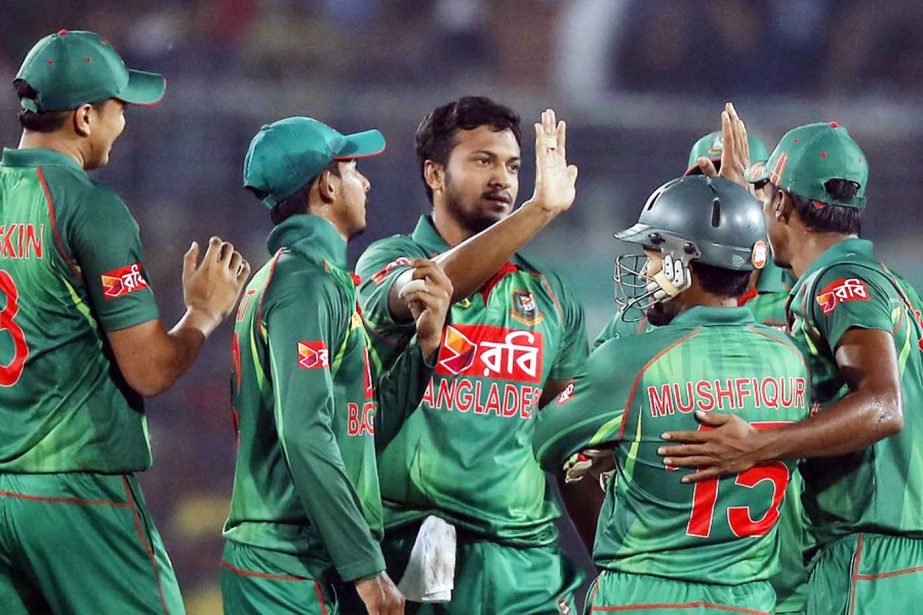 Teammates congratulate Bangladesh's Shakib Al Hasan, center, after the dismissal of Afghanistan's Nawroz Mangal during the second one-day international cricket match against Afghanistan at the Mirpur Sher-e-Bangla National Cricket Stadium on Wednesday.