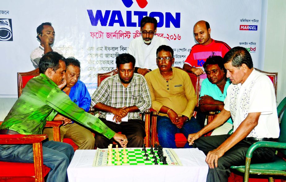 Sharif Khan of The New Nation moves a pawn against Rafiq uddin Enayet of Banglar Chokh during the chess competition of the Walton 2nd Photo Journalists Sports Festival at the auditorium of Bangladesh Photo Journalists Association on Thursday.