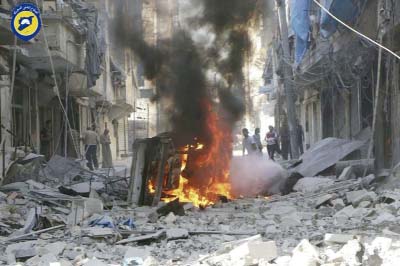 Syrian Civil Defense group known as the White Helmets, Syrians inspect damaged buildings after airstrikes by government helicopters on the rebel-held Aleppo neighbourhood of Mashhad, Syria on Tuesday