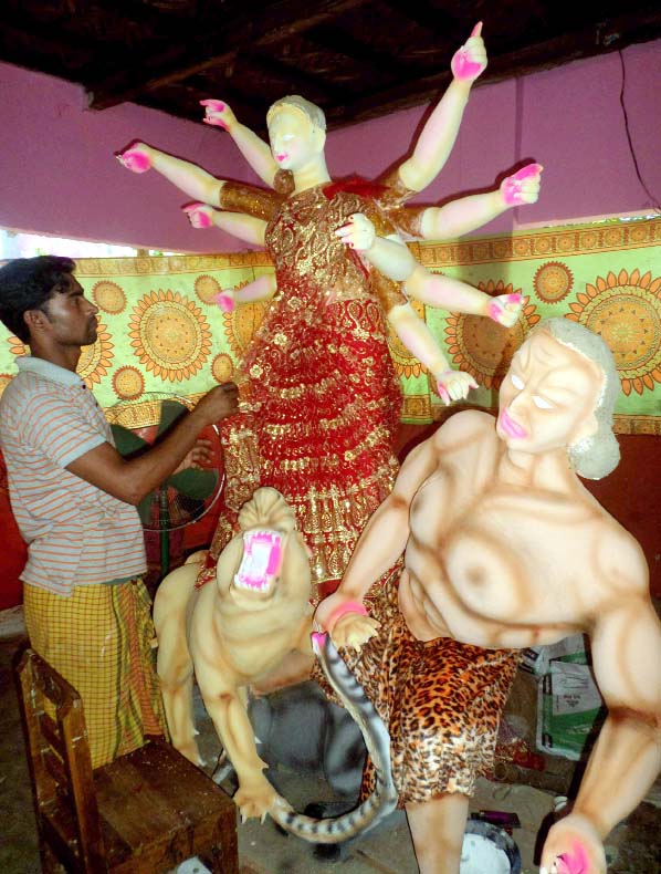 Finishing task to idol is being done as the Durga Puja is coming nearer . This picture was taken from Anandanagar Mondir in Khagrachhari yesterday.