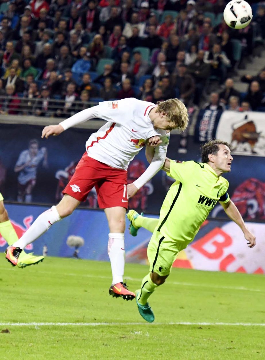 Leipzig's Emil Forsberg (left) challenges for the ball besides Augsburg's Paul Verhaegh (right) during the German first division Bundesliga soccer match between RB Leipzig and FC Augsburg in Leipzig, Germany on Friday.