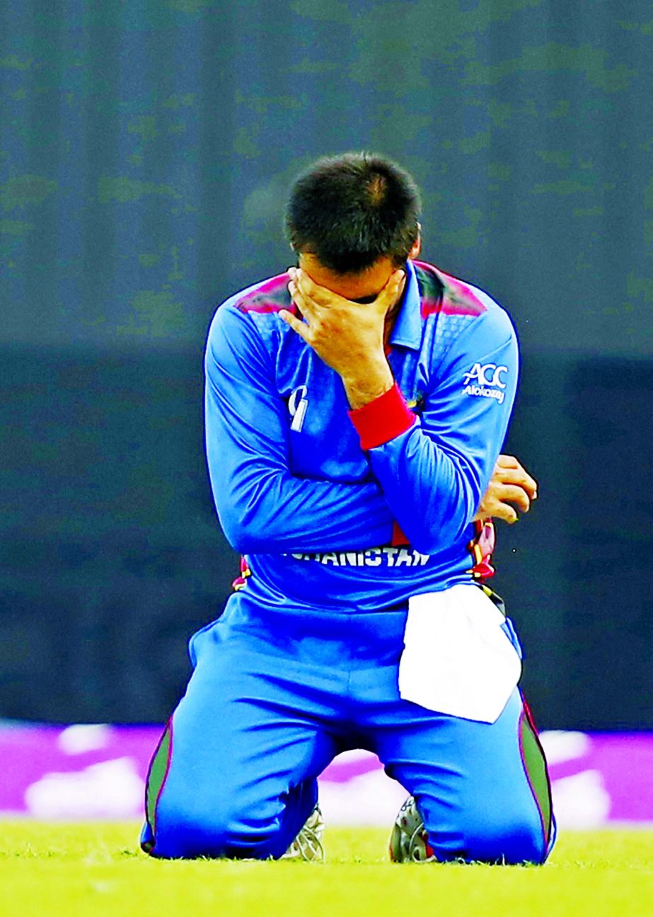 Afghanistan's captain Asghar Stanikzai reacts after dropping a catch during the third One Day International cricket match against Bangladesh at the Sher-e-Bangla National Cricket Stadium on Saturday.