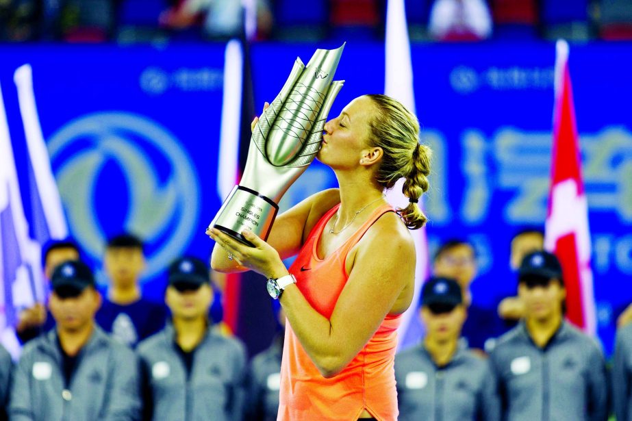 Petra Kvitova of the Czech Republic kisses the trophy after winning the women's singles final at the WTA Wuhan Open in Wuhan in central China's Hubei province on Saturday.