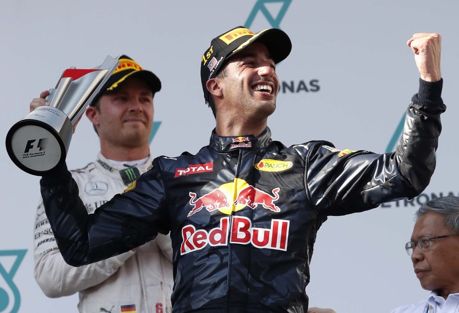 Red Bull driver Daniel Ricciardo of Australia celebrates on the podium after winning the Malaysian Formula One Grand Prix at the Sepang International Circuit in Sepang, Malaysia on Sunday.