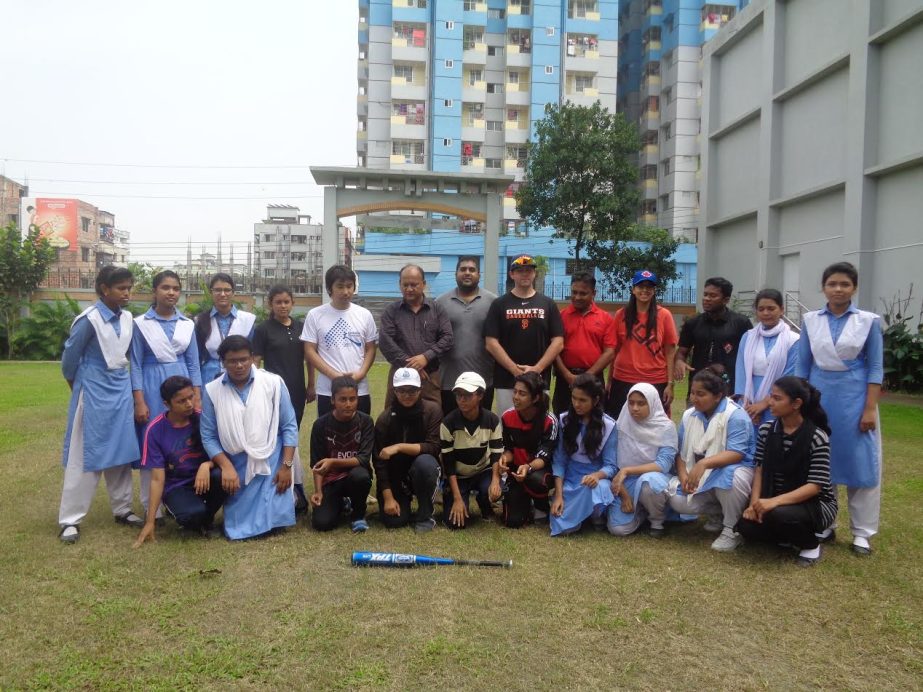 The participants of the Women's baseball training programme with the instructors and the officials of Bangladesh Baseball-Softball Association pose for a photograph at Mirpur Commerce College in the city on Sunday.