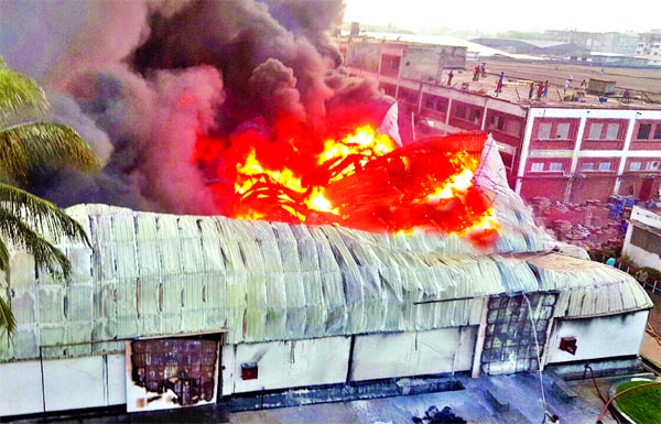 A devastating fire broke out at a spinning mill at Shafipur in Kaliakoir Upazila of Gazipur and a huge fire (inset) also engulfs the warehouse sheds of Benapole Land Port on the India-Bangladesh border on Sunday.