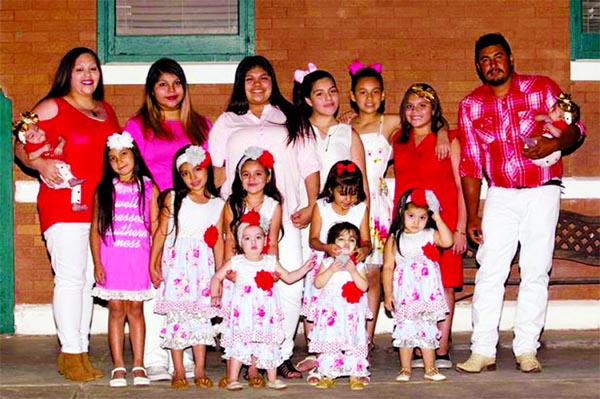SUPER MOM: Augustina, pictured with her fourteen daughters and husband Jose, says she'd have another 10 if it meant she'd have a boy. Internent photo