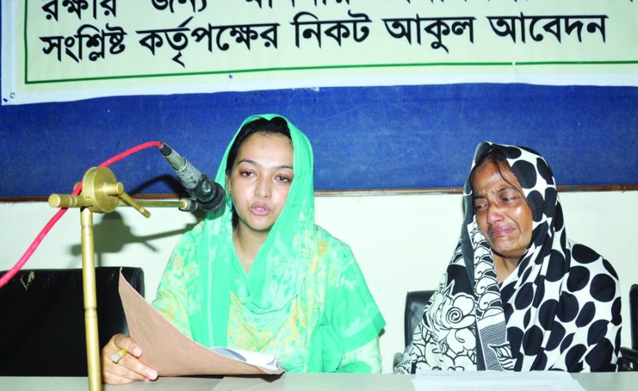 Affected family members at a press conference at Dhaka Reporters Unity on Monday to seek Prime Minister's intervention to save the lives of the family members of a freedom fighter in Patuakhali.