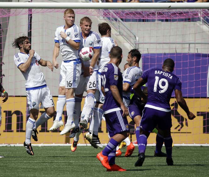 Montreal Impact players, including Calum Mallace (16) and Kyle Fisher (26) block a free kick by Orlando City's Julio Baptista (19) during the second half of an MLS soccer game in Orlando, Fla on Sunday. Montreal won 1-0.