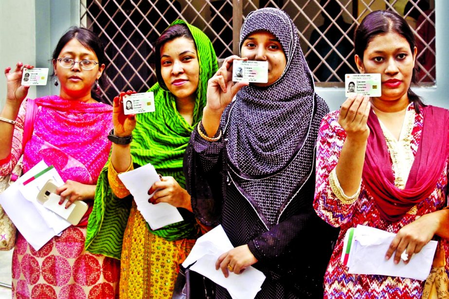 Four females, who received new smart NID cards on Monday, are seen smiling in the city's Siddheswari Girls College area on Monday.