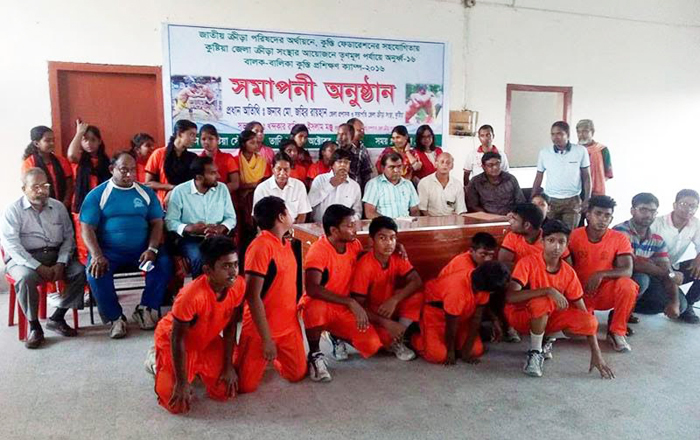 The selected under-16 wrestlers of grass-root level selection and training programme with the officials of Kushtia District Sports Association and the guests pose for a photo session at the Gymnasium of Kushtia District Stadium on Monday. Kushtia District