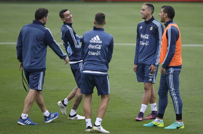 Angel Di Maria (second left) laughs next to his teammates Rogelio Funes Mori (second right) during a training session in Lima, Peru on Tuesday. Argentina will face Peru in a World Cup qualifying soccer game in Lima Today.