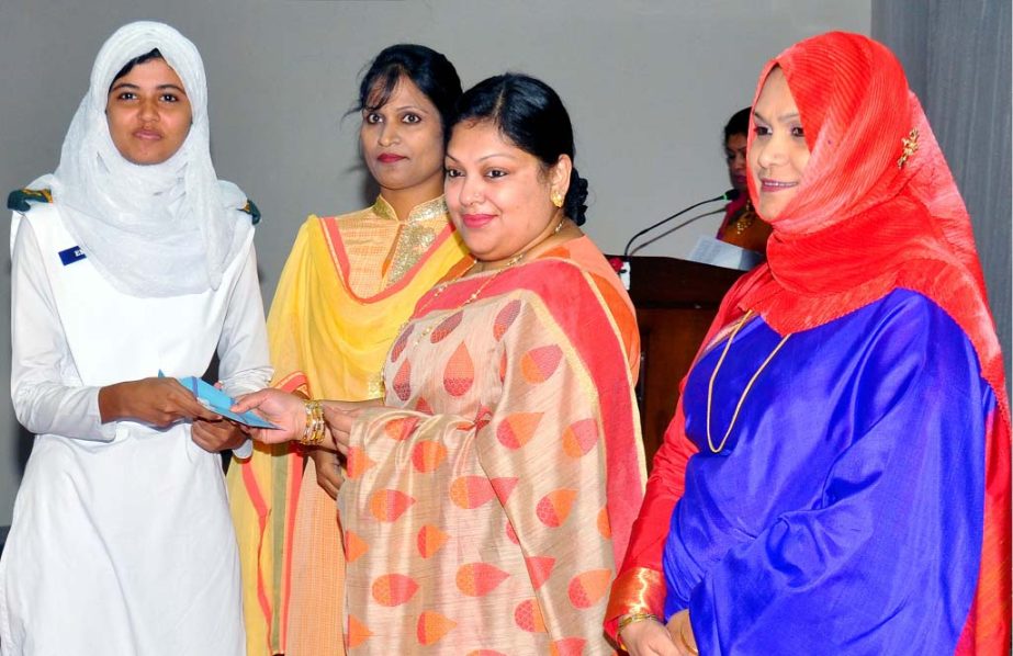 BAFWWA President Tasneem Esrar hands over cheques of stipend to the meritorious students at Falcon Hall, Tejgaon in the capital on Tuesday.