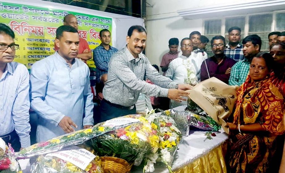 CCC Mayor AJM Nasir Uddin distributing clothes among the Hindu community at Bagmoniram Ward in the city yesterday.