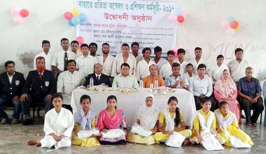 The participants of the grass-root level karate selection and training programme with the officials of Bangladesh Karate Federation and the local officials of Noakhali pose for photo at the gymnasium of Shaheed Bhulu Stadium in Noakhali on Saturday.