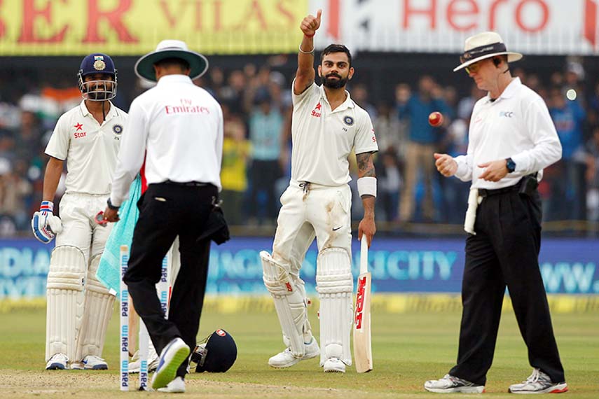 Virat Kohli gestures to the dressing room after scoring his century on the 1st day of 3rd Test between India and New Zealand at Indore on Saturday.