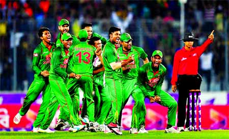 Players of Bangladesh cricket team celebrate as Jos Buttler is given out after a review during the 2nd ODI between Bangladesh and England at the Mirpur Sher-e-Bangla National Cricket Stadium on Sunday.