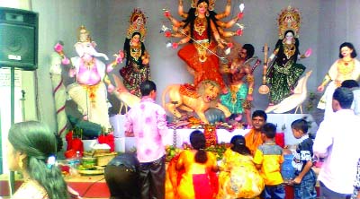 RANGPUR: The Hindu devotees visiting a Durga Puja mandap seeking blessing of goddess Durga as elsewhere in Rangpur Division on Mohanabomi yesterday.