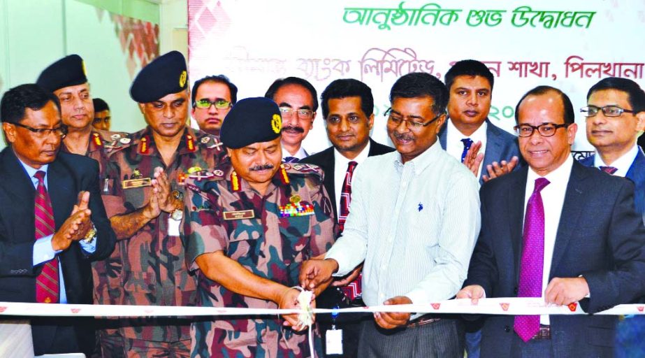 Major General Aziz Ahmed, Director General of Border Guard Bangladesh and Chairman of Shimanto Bank Ltd, inaugurating its principal branch at Shimanto Square on Monday in the city. Muklesur Rahman, Managing Director and CEO of the bank was present on the