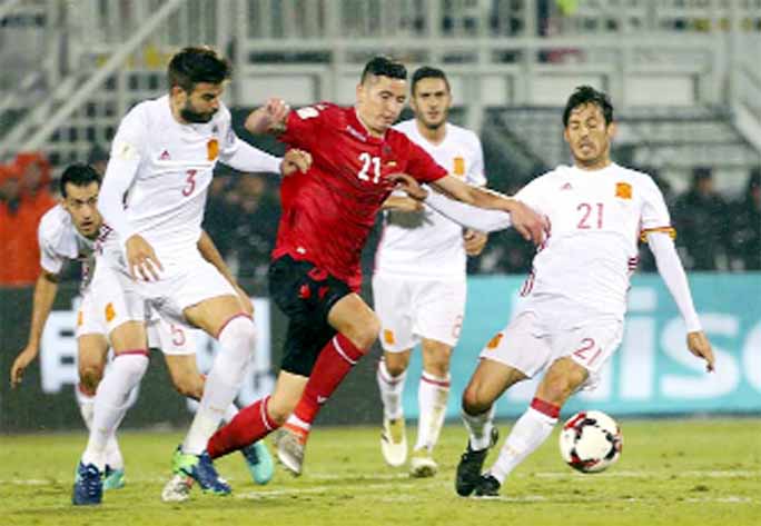 Spain's Gerard Pique, left, and David Silva during their World Cup Group G qualifying soccer match at Loro Borici Stadium, in Shkoder, northern Albania on Sunday.