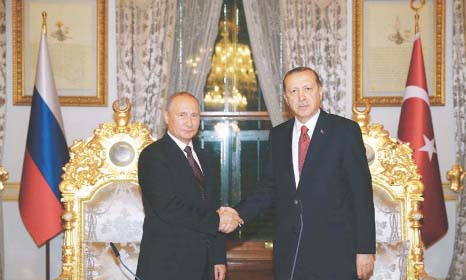 Russian President Vladimir Putin (L) shaking hands with his Turkish counterpart Tayyip Erdogan in Istanbul, Turkey on Monday.